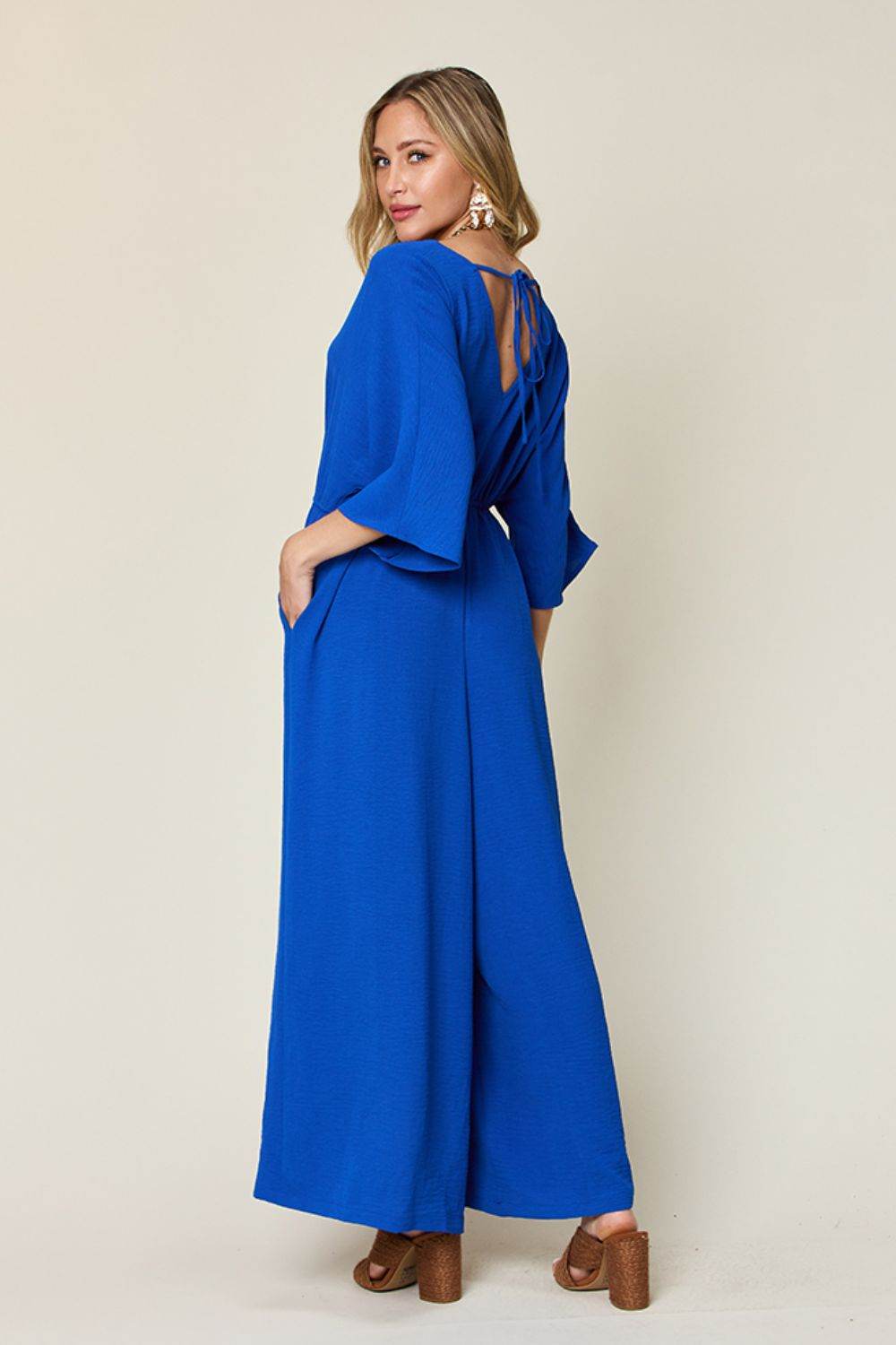 Double Take Full Size Surplice Wide Leg Jumpsuit with Pockets - Shop Style & More | Fresh Looks, Everyday Deals & Free Shipping